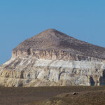 Close-up view of Sherkala's white, pink and brown cliffs.