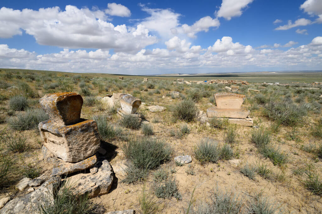 A cluster of koitas headstones sat in the steppe.