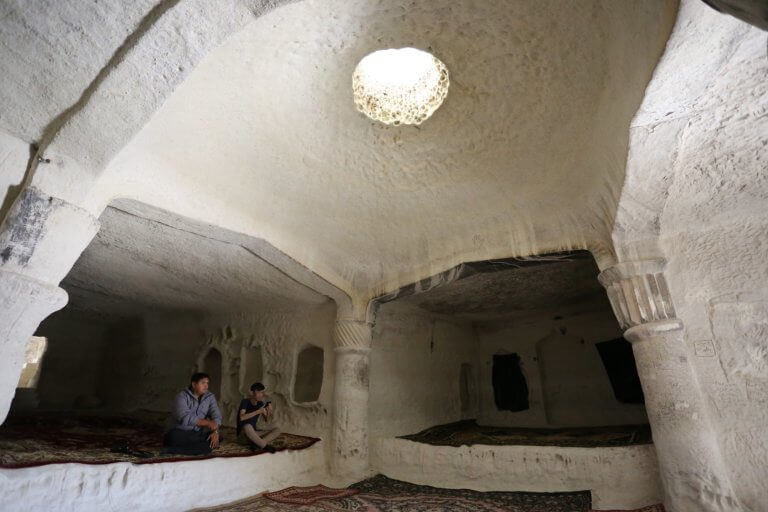Inside Shakpak-Ata's cruciform chamber with a hole in the roof.